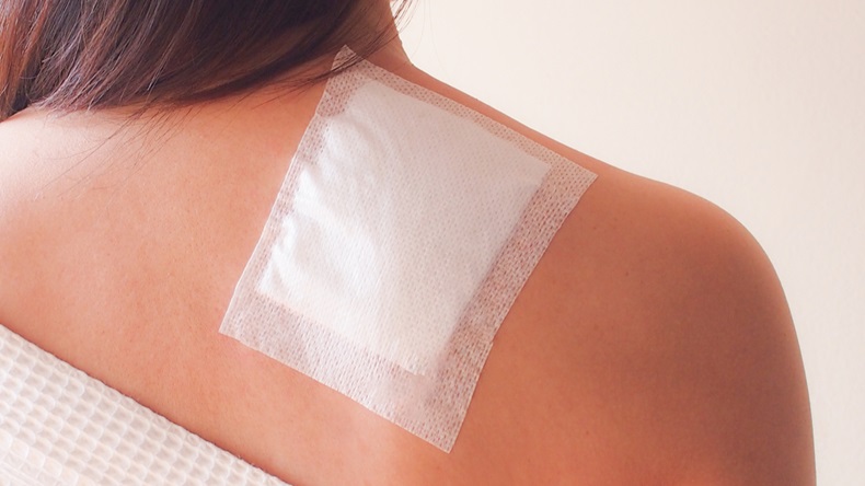 Medicated pain relief patch with woman pain shoulders office syndrome by occupation disease. 