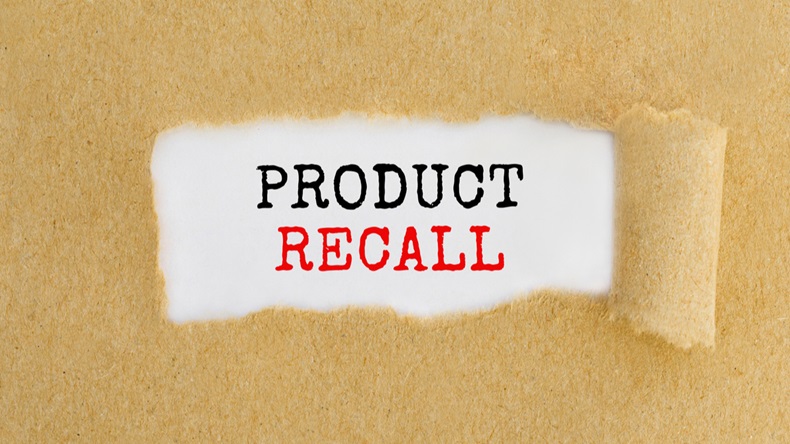 Text Product Recall appearing behind ripped brown paper.