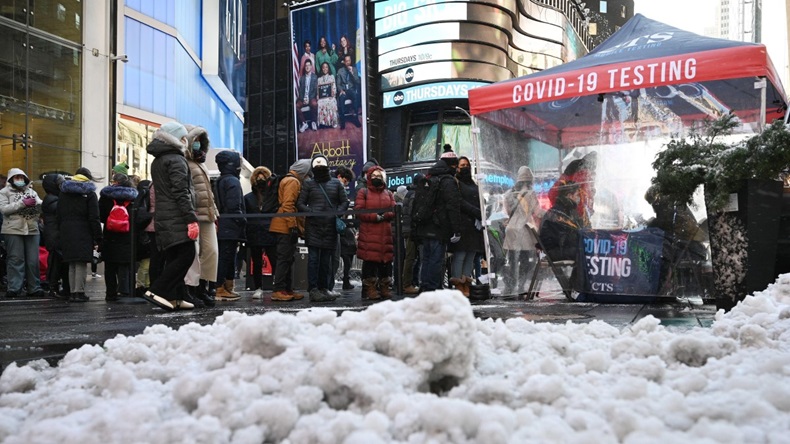 People standing in line to take a COVID-19 test in Times Square in New York City on 7 January, 2022