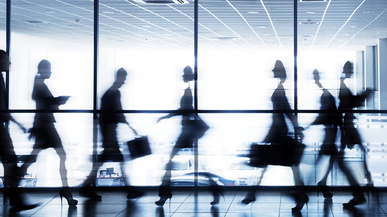 moving silhouettes of businesspeople interacting office background