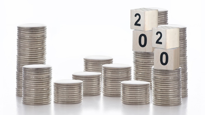 Year 2020 on stack of coins on white background, business success concept and growth idea - Image 