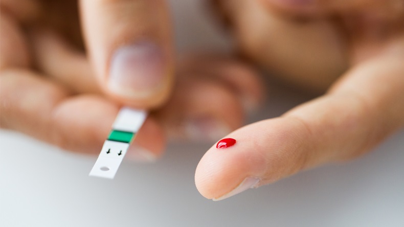 medicine, diabetes, glycemia, health care and people concept - close up of male finger with blood drop and test stripe - Image 