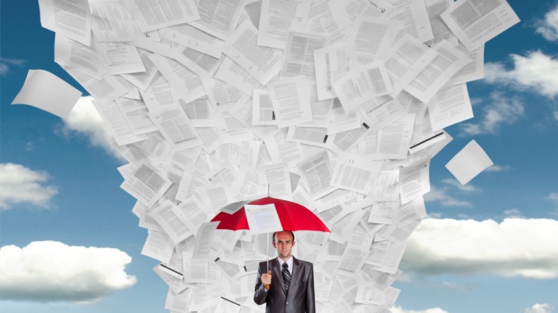 Serious businessman with red umbrella under huge wave of documents - Image 