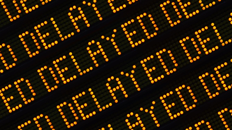 A Close Up Of The Word Delayed Repeated Multiple Times On A Sign At A Station Or Airport Or Highway