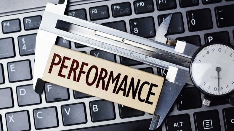 Performance measurement or level with caliper on computer notebook
