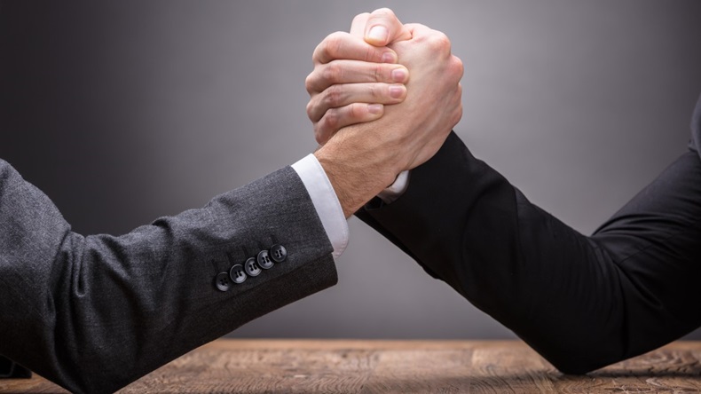 Close-up Of two businesspeople arm wrestling