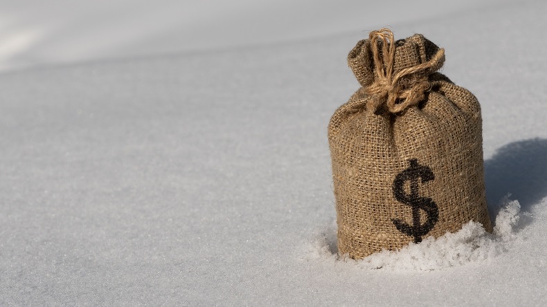 Burlap money bag sitting in the snow