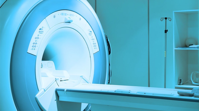 MRI scanner room in hospital take with art lighting and blue filter